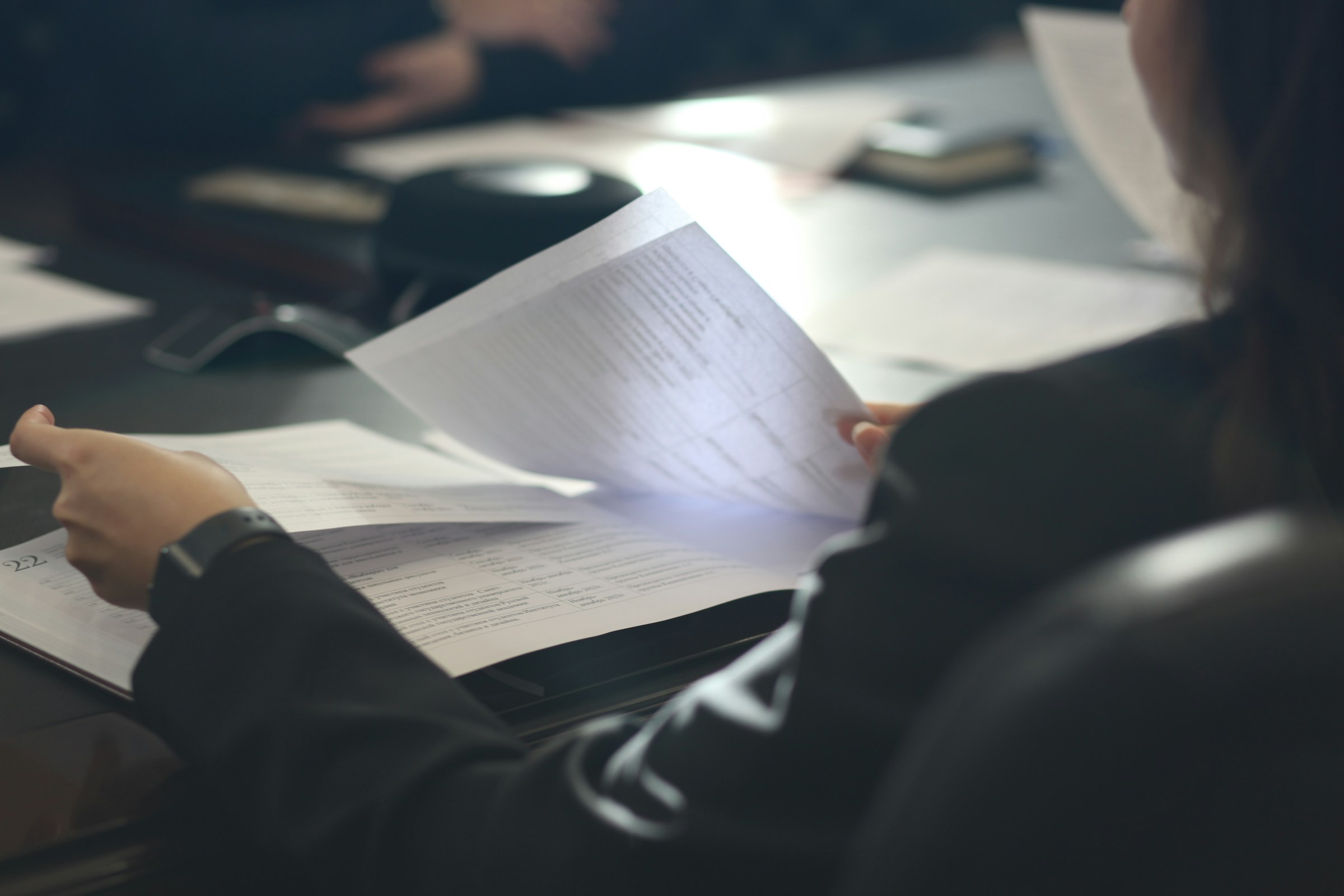 Specialist reviewing a document before the next step