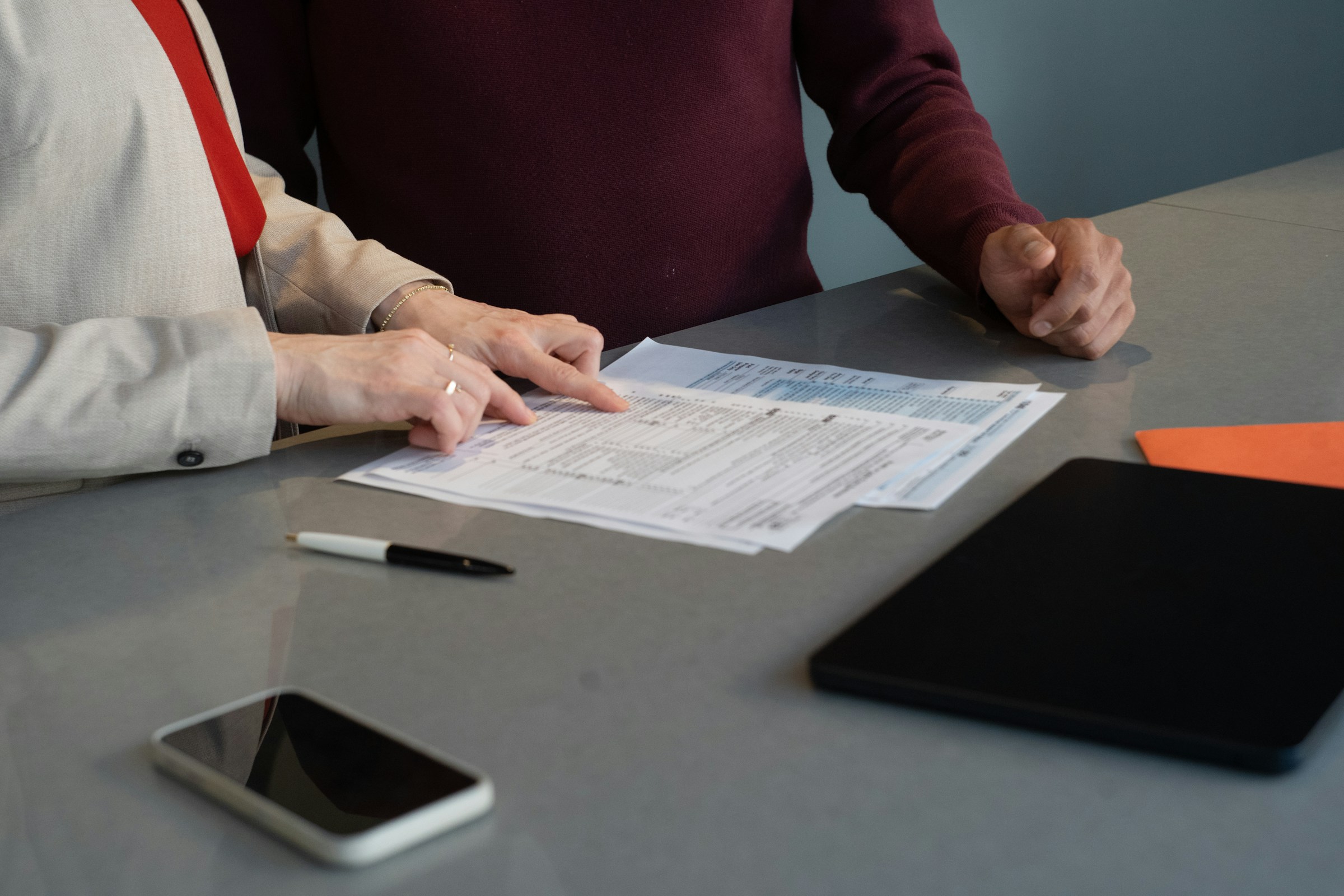 Professionals reviewing paperwork together