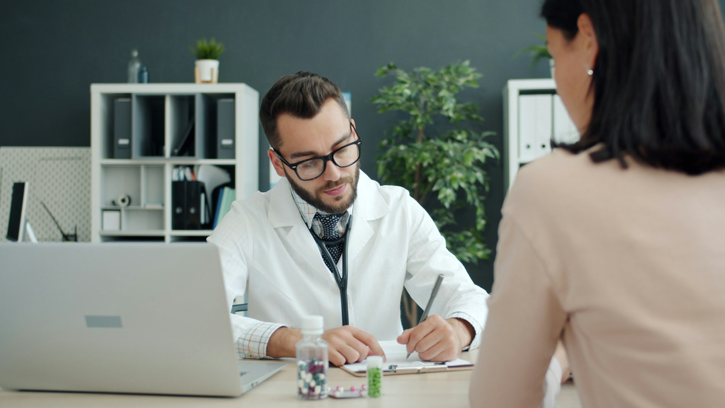 Physician and patient discussing care in a modern clinic
